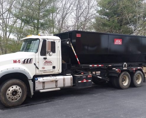 A branded dumpster truck